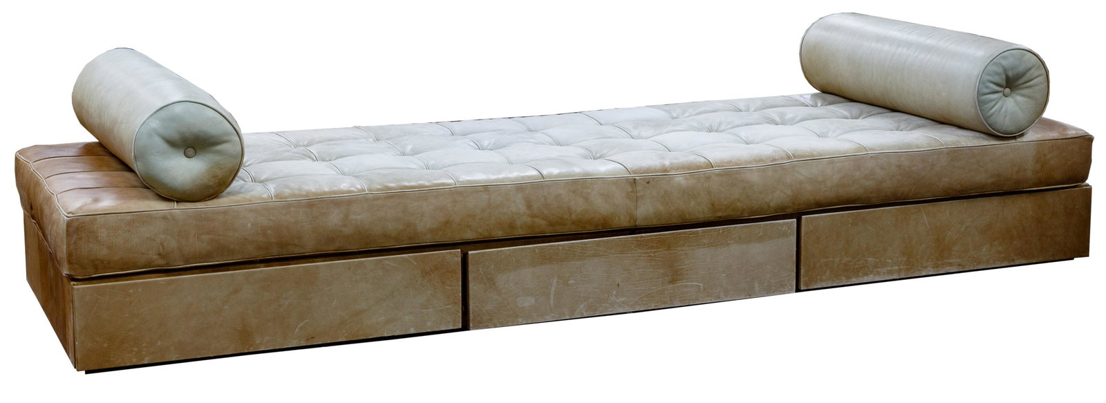 Interior Crafts Custom Daybed for the John Hancock Resi: Interior Crafts Custom Daybed for the John Hancock Residences Tan leather tufted cushions having two round bolster pillows and wooden three drawer storage base; label to the fabric; provenance: John H