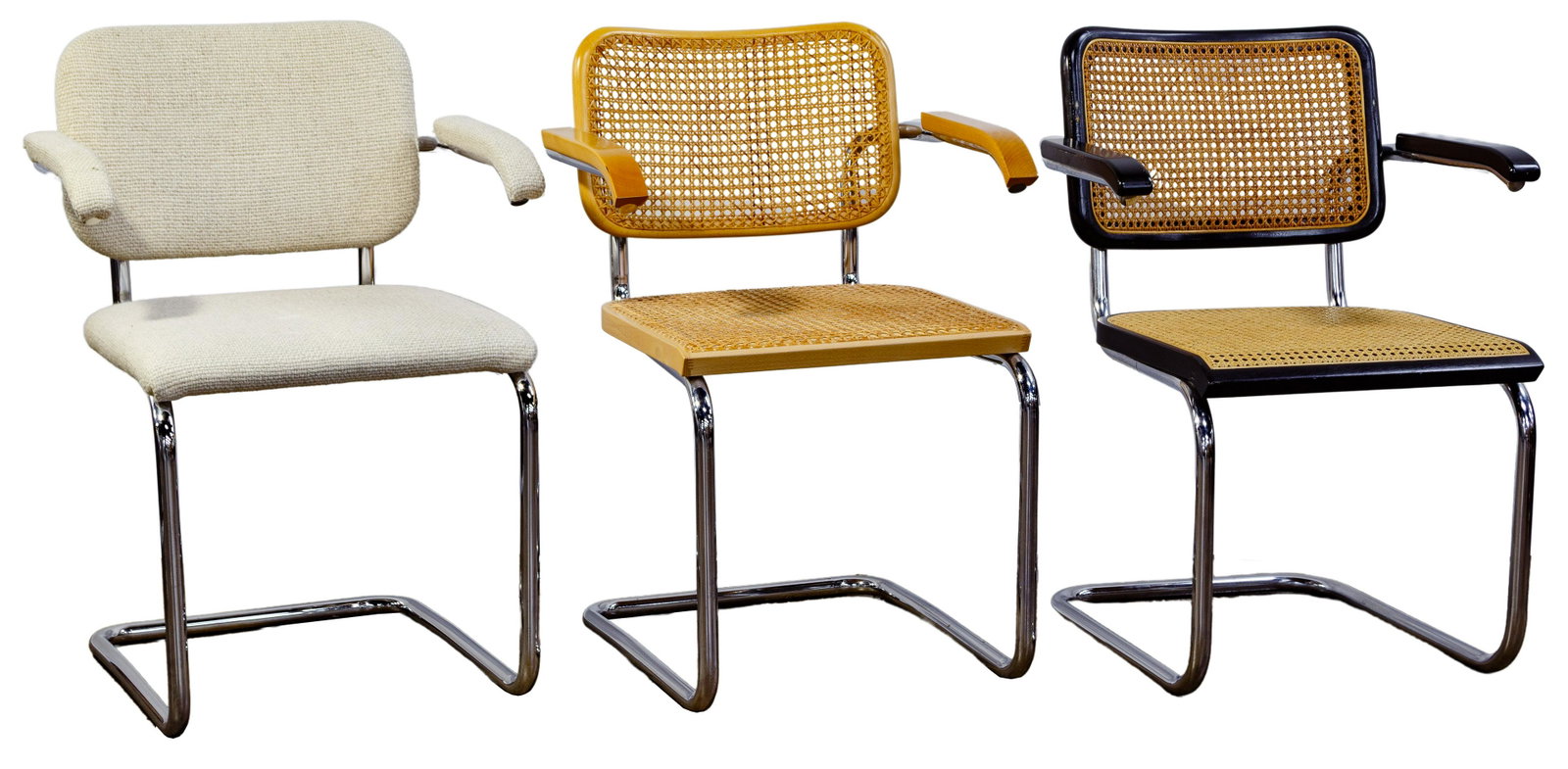 Knoll Cesca Arm Chair Assortment: Knoll Cesca Arm Chair Assortment MCM, in the style of Marcel Breuer, (3) items including a natural beech having caned back and seat, an ebonized beech having caned back and seat and an almond fabric b