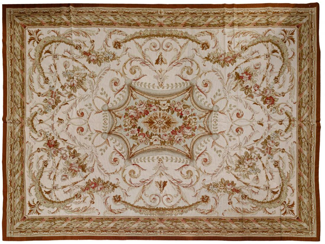 Aubusson Wool Needlepoint Rug: Aubusson Wool Needlepoint Rug Floral having a medallion center, cream background with hues of brown, light green and cranberry Condition: Very Good, overall light wear consistent with age and normal u