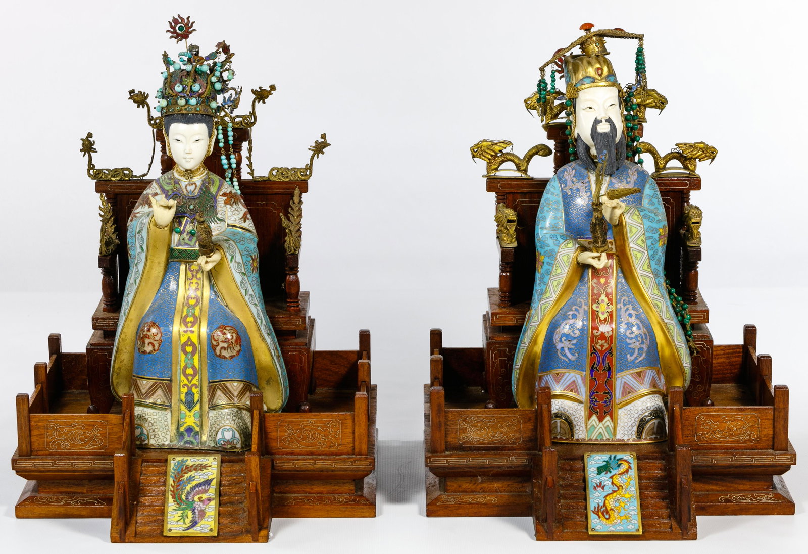 Asian Cloisonne and Wood Figurines: Asian Cloisonne and Wood Figurines Two figurines, an emperor and empress sitting on wood thrones wearing cloisonne robes Condition: Very Good to Good, overall light wear consistent with age and normal