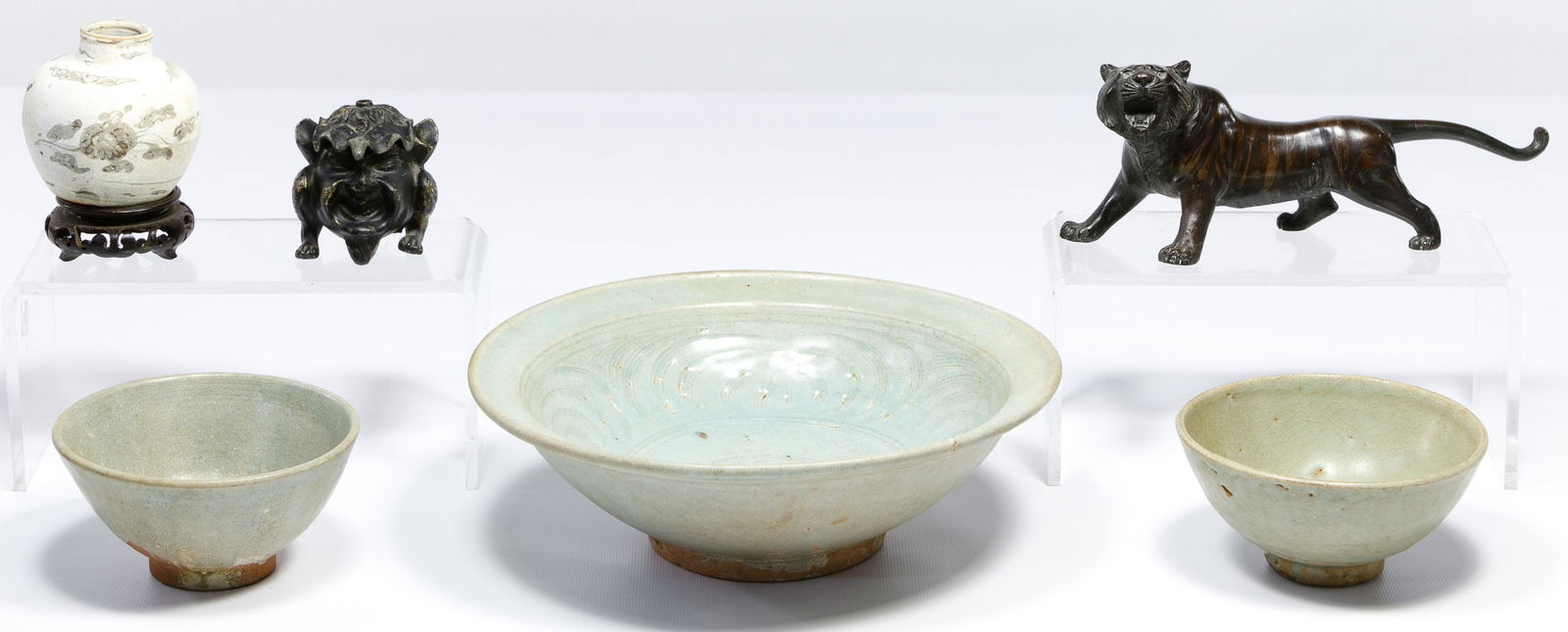Asian Pottery Assortment: Asian Pottery Assortment Three Thai Sawankhalok celadon bowls, small white Southeast Chinese Ming vase having a hare hallmark on underside on a rosewood stand; together with Titivillus smelter inkwell