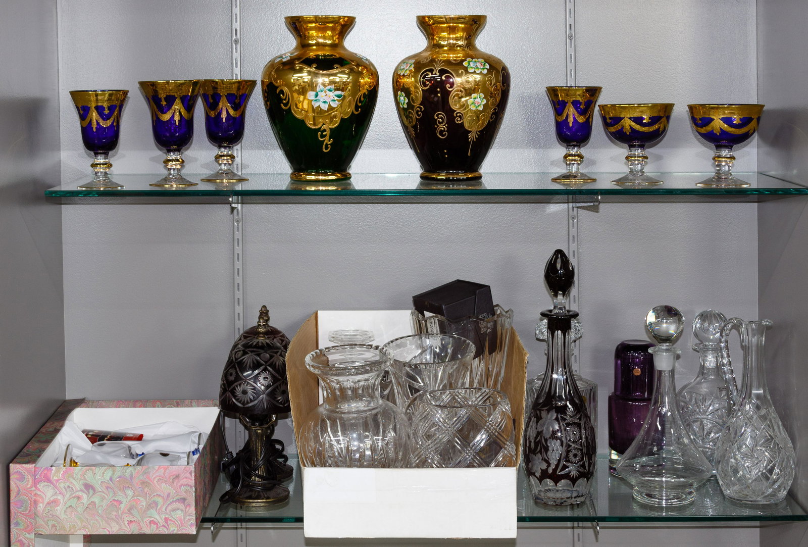 Crystal and Glass Assortment: Crystal and Glass Assortment Twenty-nine items including a vase labeled 'Orrefors', two accent lamps having cut-to-clear shades, examples of Bohemian glass style vases and goblets, clear and cut-to-cl