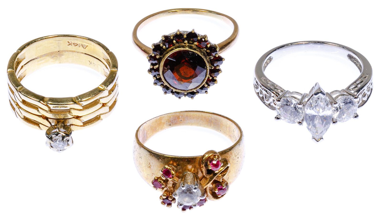 14k Gold and Gemstone Ring Assortment: 14k Gold and Gemstone Ring Assortment Four rings including a white gold ring and yellow gold having a round cut garnet ring, a round cut diamond engagement ring having an attached wedding band and a r