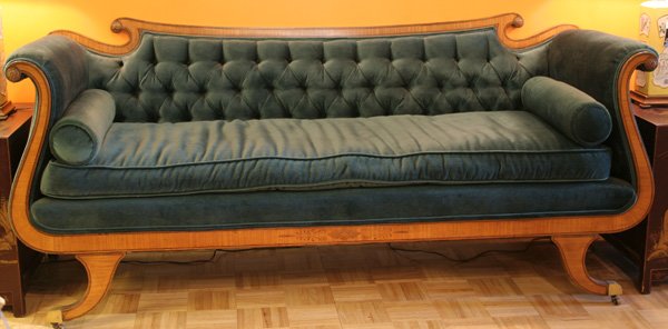 Regency style satinwood and mahogany inlaid uph: Regency style satinwood and mahogany inlaid upholstered and button tufted settee. Upholstered cushions are down-filled. Scrolled crestrail and arms have a foliate patera, raised on downswept legs, end