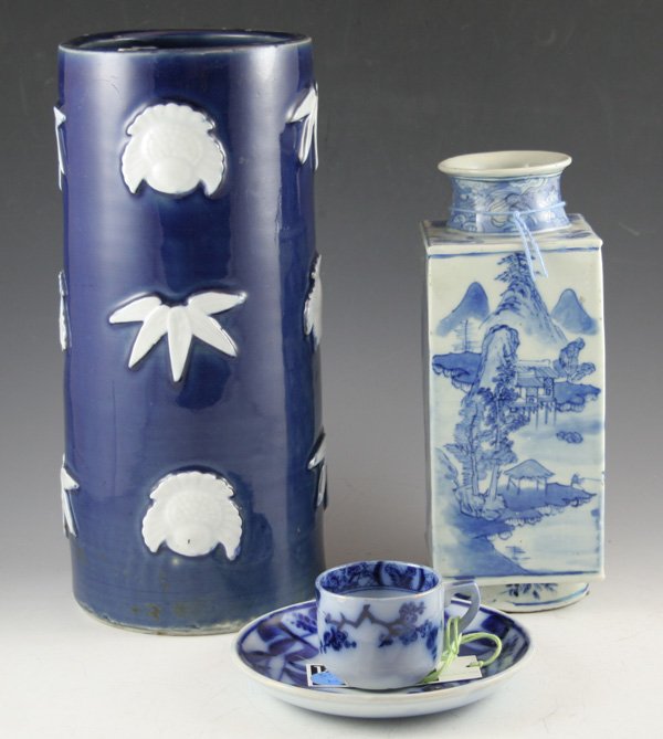 Chinese blue and white porcelain vase: Chinese blue and white porcelain vase with Daoguang mark. Vase is square form with mountain landscape. Flow Blue Floral demi-tasse cup with unmatched saucer. DIMENSIONS: 9 3/4H CONDITION: Good Conditi