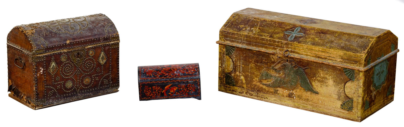Folk Art Carved and Painted Chest: Folk Art Carved and Painted Chest Having a bird design on the front in red and blue paint; together with a traditional style trunk covered with leather and nail head trim, inside floral paper covering