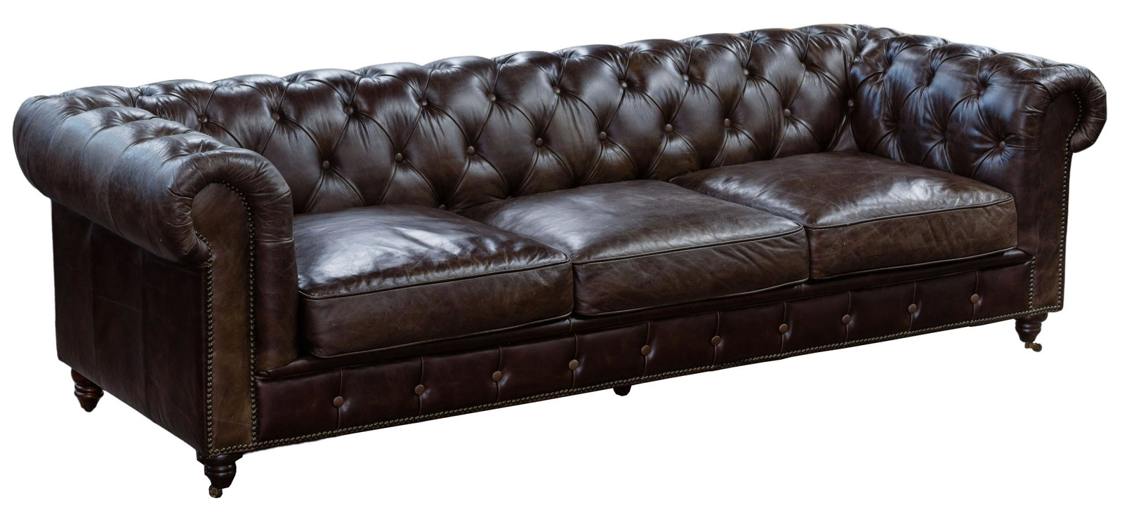 (Attributed to) Restoration Hardware 'Kensington': (Attributed to) Restoration Hardware 'Kensington' Leather Sofa Dark brown button-tufted leather having (3) cushions, rolled arms and wood legs on casters Property from: an Oak Park, Illinois collector