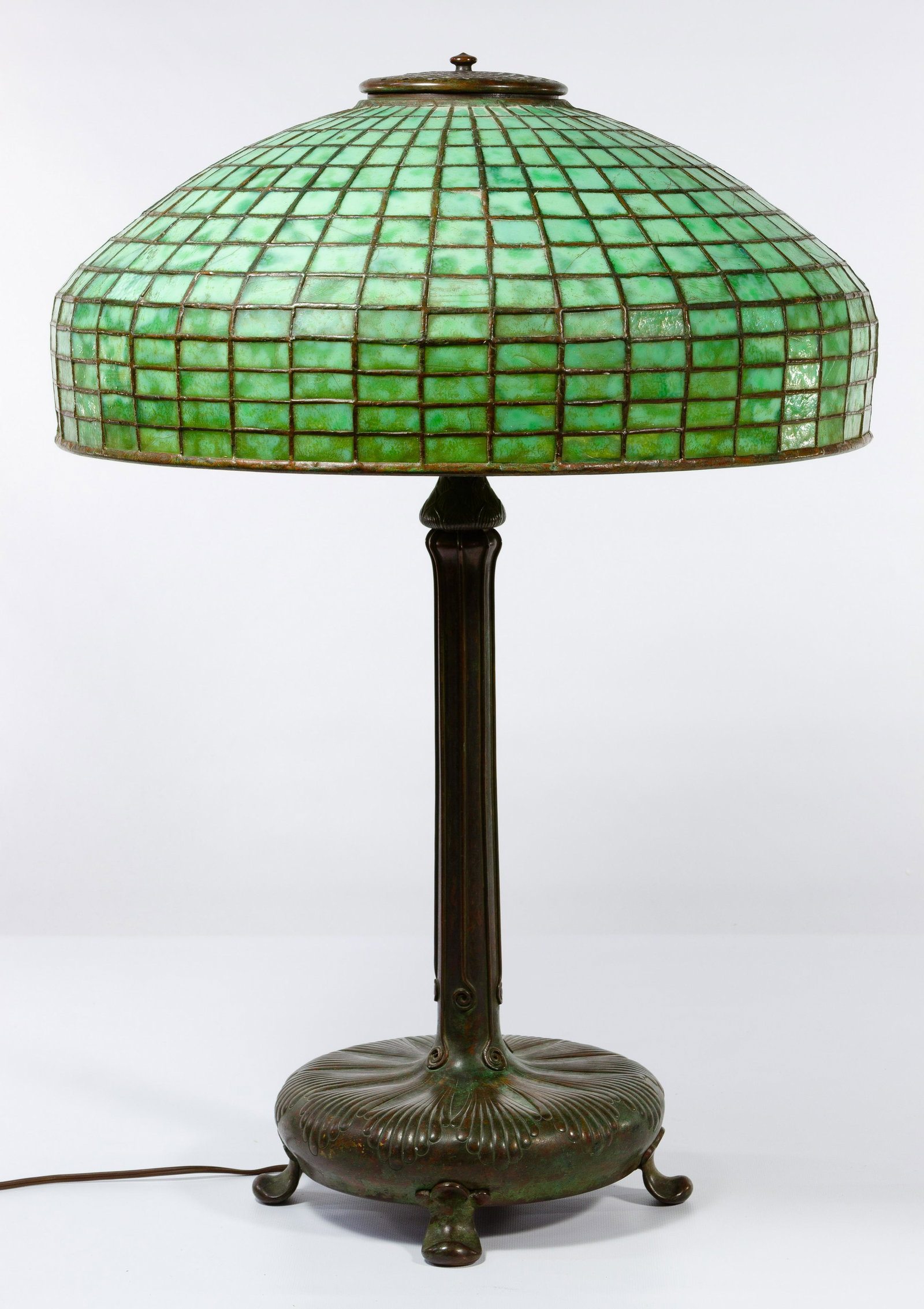 (Attributed to) Tiffany Studios #9922 Lamp with Leaded: (Attributed to) Tiffany Studios #9922 Lamp with Leaded Glass Geometric Shade Bronze base impressed 'Tiffany Studios' and '9922' on the underside, green geometric leaded glass shade impressed 'Tiffany 