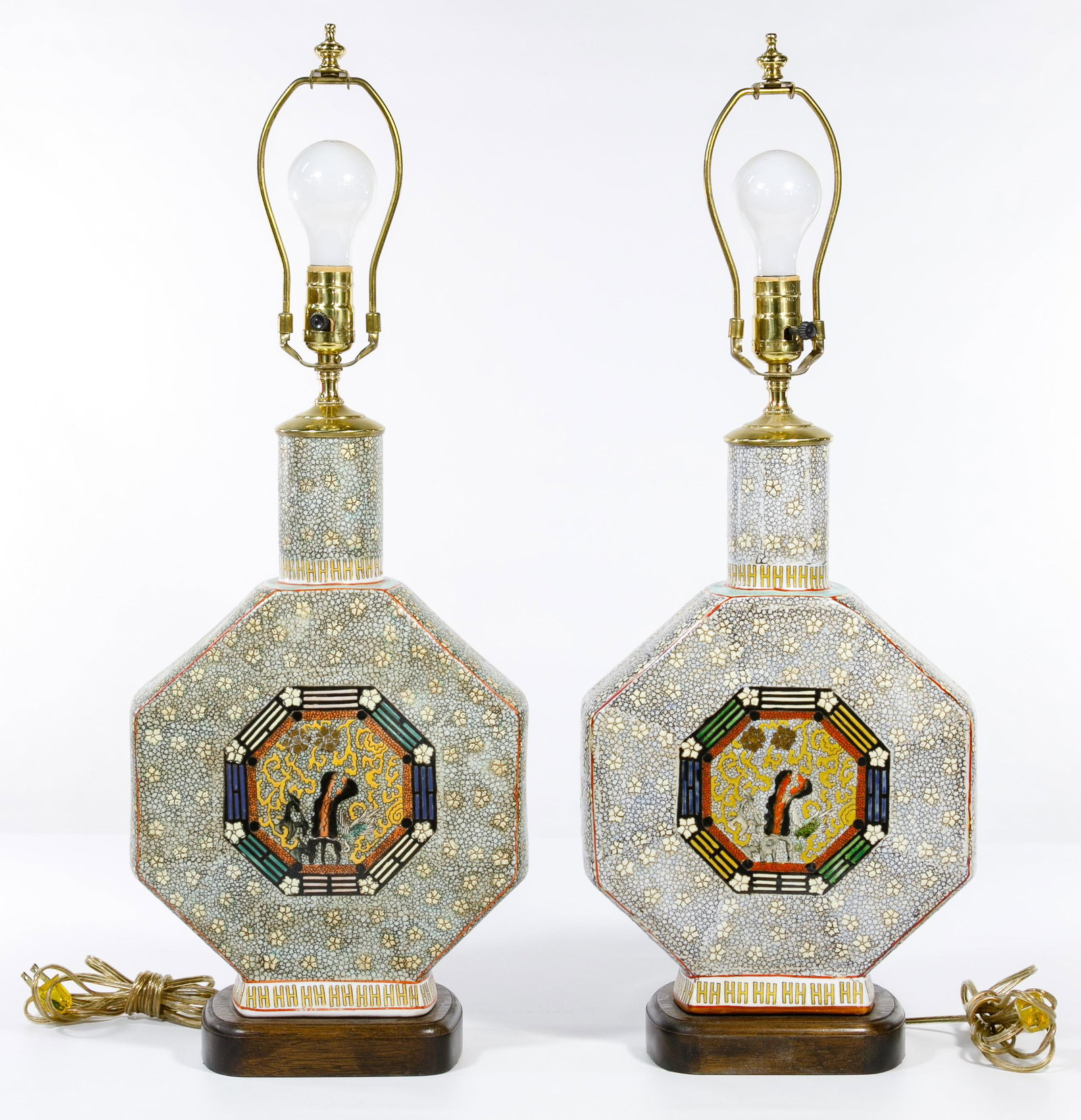 Asian Ceramic Moon Flask Table Lamps: Asian Ceramic Moon Flask Table Lamps (2) lamps having a light blue and white morriage finish in a floral motif, octagon shape and a multi-colored octagon border around small animals and gold painted f