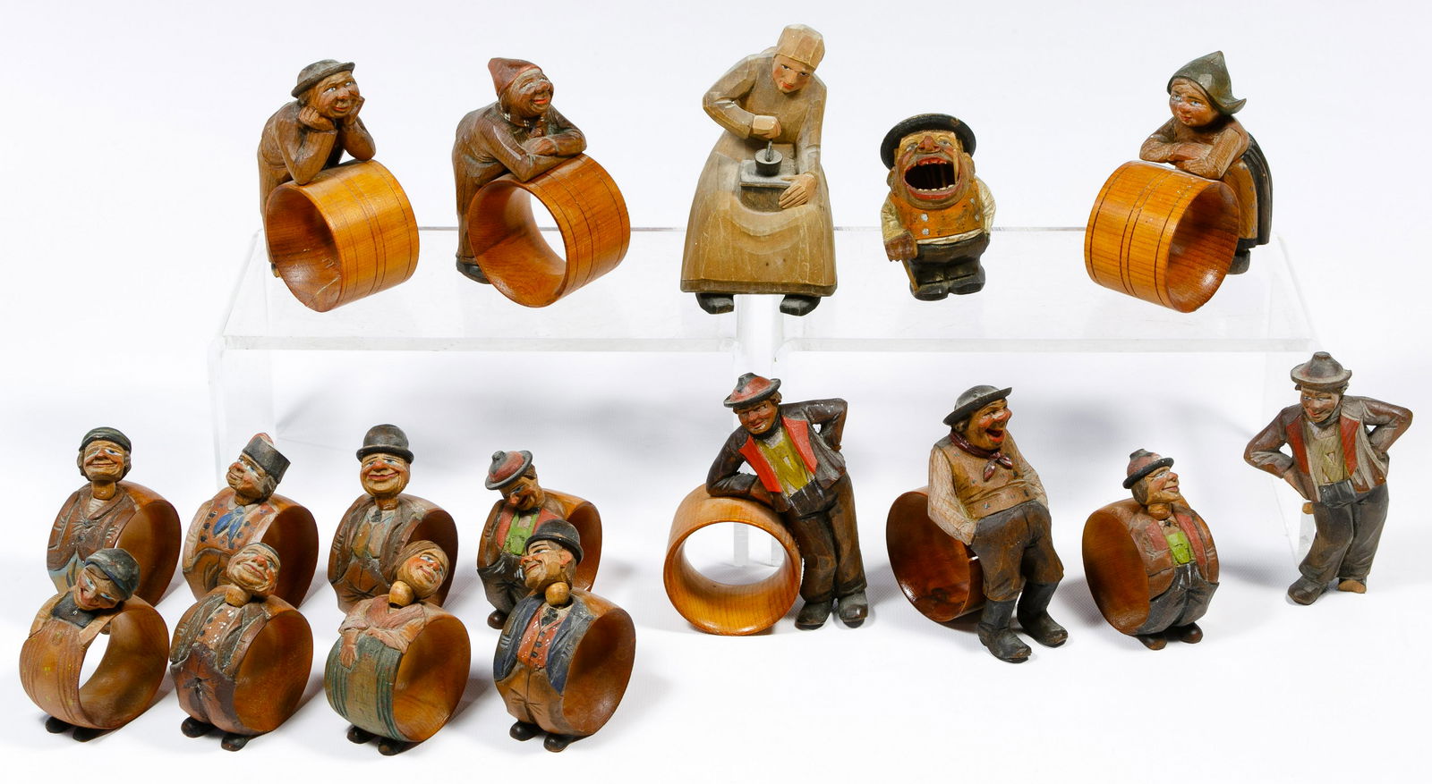 Carved Wood Figural Napkin Ring Assortment: Carved Wood Figural Napkin Ring Assortment (17) carved items having painted detail including (14) napkin rings with (9) having moving heads and (5) having full carved figures attached; together with a