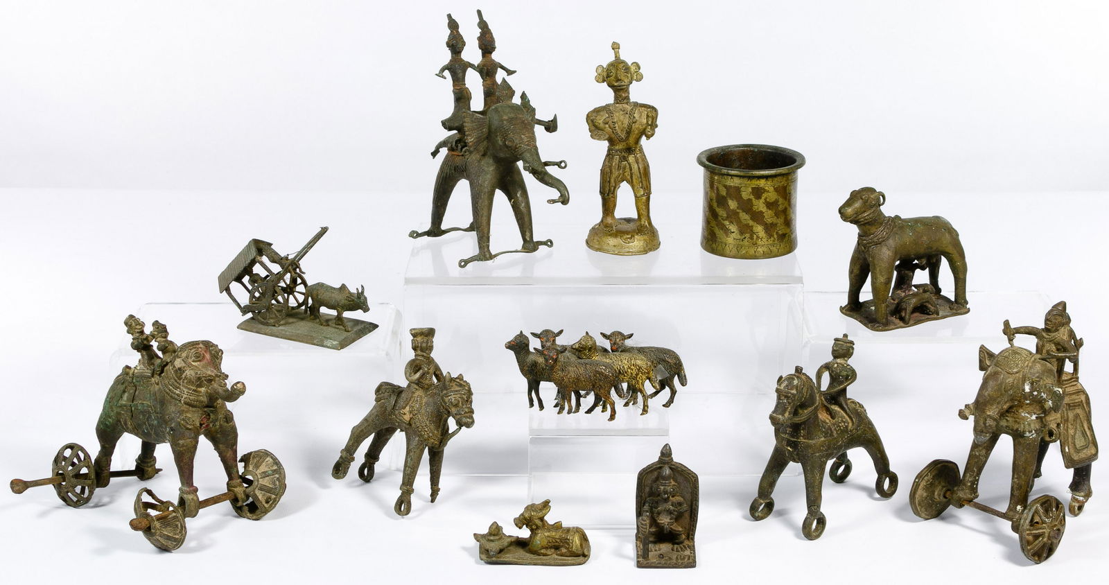 Asian Bronze Temple Toy Assortment: Asian Bronze Temple Toy Assortment (12) items including elephants on wheels, herd of sheep attributed to Franz Bergman, horses, cow and primitive figures and items Property from: a Dixon, Illinois est