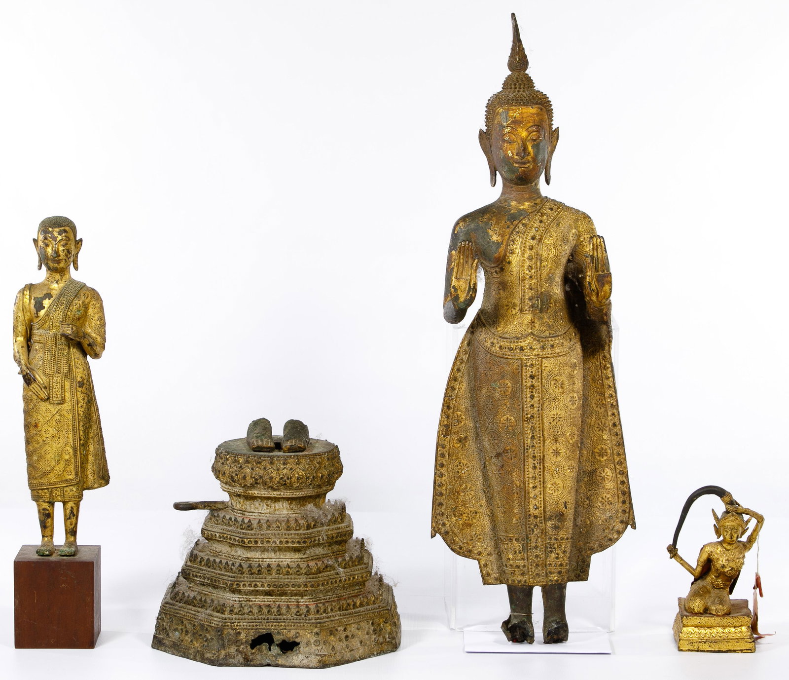 Thai Gilt Bronze Statue Assortment: Thai Gilt Bronze Statue Assortment (3) items including a smaller kneeling statue holding her hair (6.25-inches), a standing statue carrying a jug over the shoulder on a wood base (16.25-inches) and a 