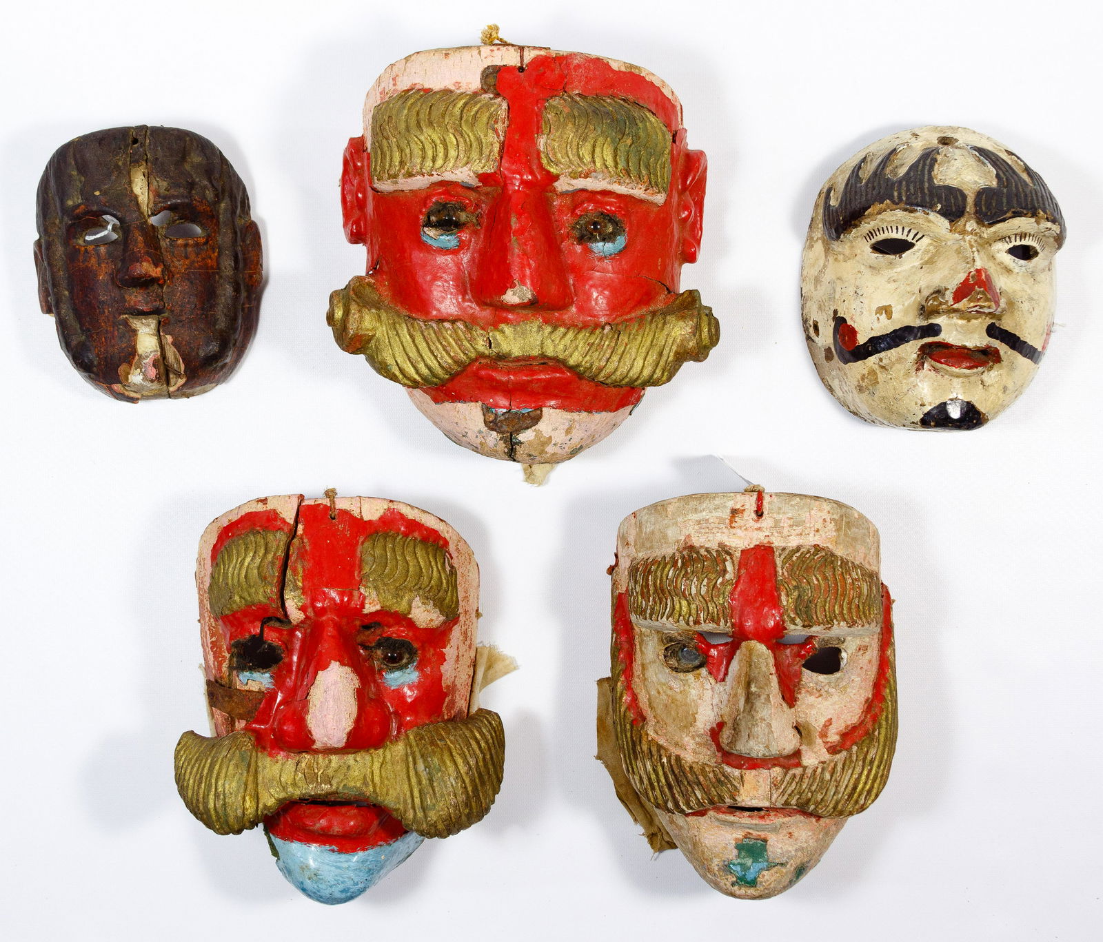 Guatemalan Dance Mask Assortment: Guatemalan Dance Mask Assortment (5) polychrome carved, painted and waxed masks, 19th / early 20th century, depicting characters from 'The Dance of the Moors and the Christians' and 'The Patzcar Dance