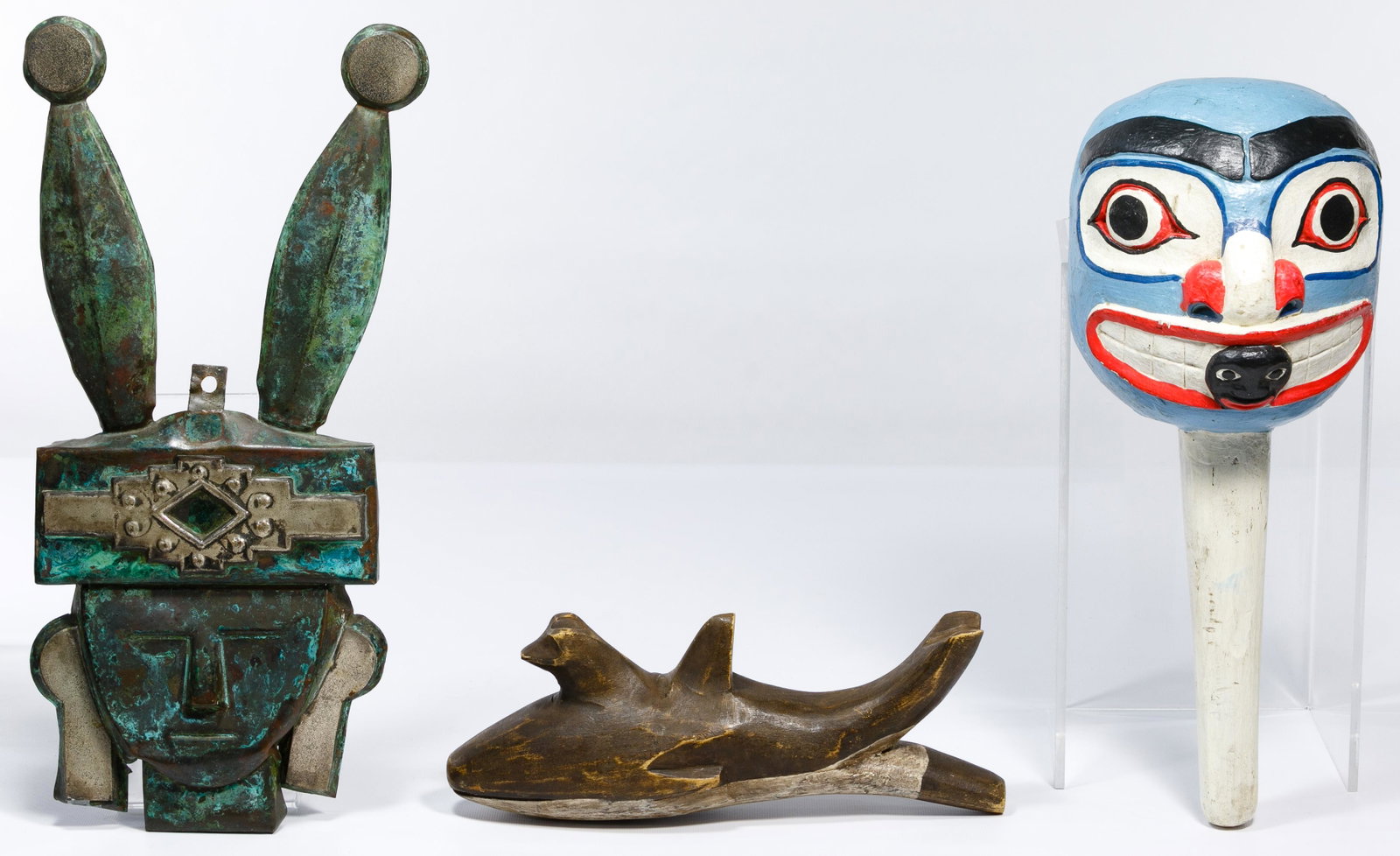 Native American Northwest Coast Rattles: Native American Northwest Coast Rattles (2) 20th Century wood rattles including a Makah killer whale effigy having a wolf head emerging in front of the dorsal fin; and a large brightly painted Haida s