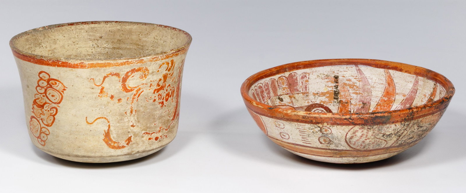 Pre-Columbian Mayan Style Pottery Bowls: Pre-Columbian Mayan Style Pottery Bowls (2) items including shallow polychrome bowl having a fish motif on the inner side with a geometric design on the outer side and taller bowl having drawings on t