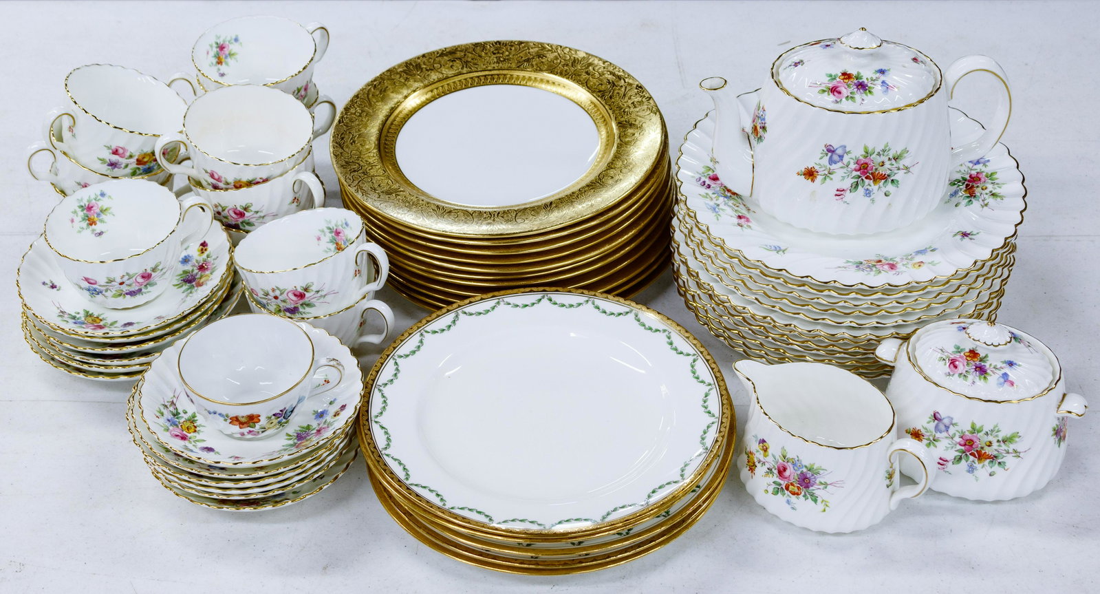 Tiffany & Co and Minton China Assortment: Tiffany & Co and Minton China Assortment (31) pieces including (10) Crown Staffordshire for Tiffany & Co luncheon plates having 1.75-inch gold banding with embossed botanical decoration; Minton 'Marlo