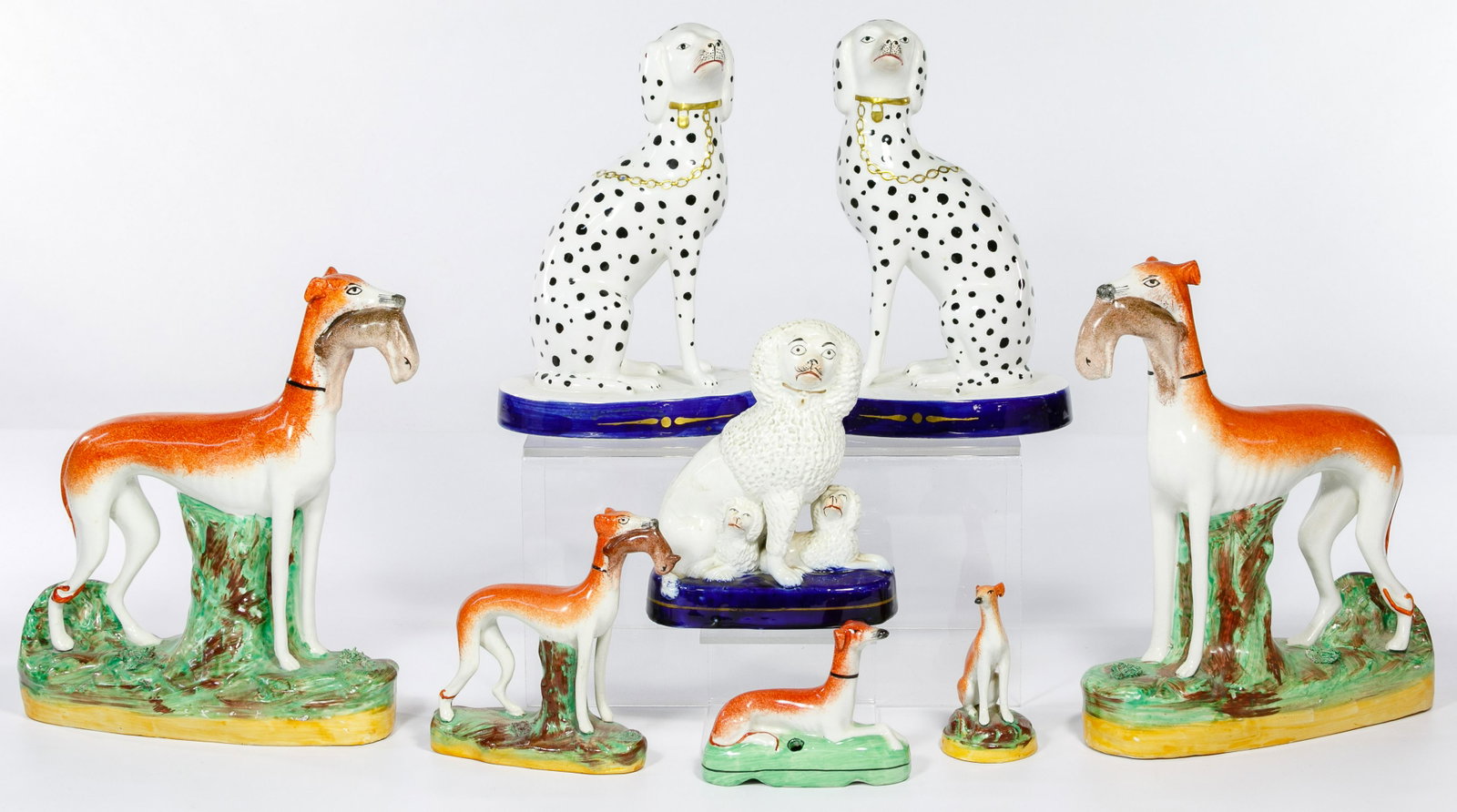 Mottahedeh and Staffordshire Style Dog Assortment: Mottahedeh and Staffordshire Style Dog Assortment (8) items including a pair of Italian pottery Dalmatians on cobalt bases, marker marks on underside; (6) Staffordshire style figurines including (3) g