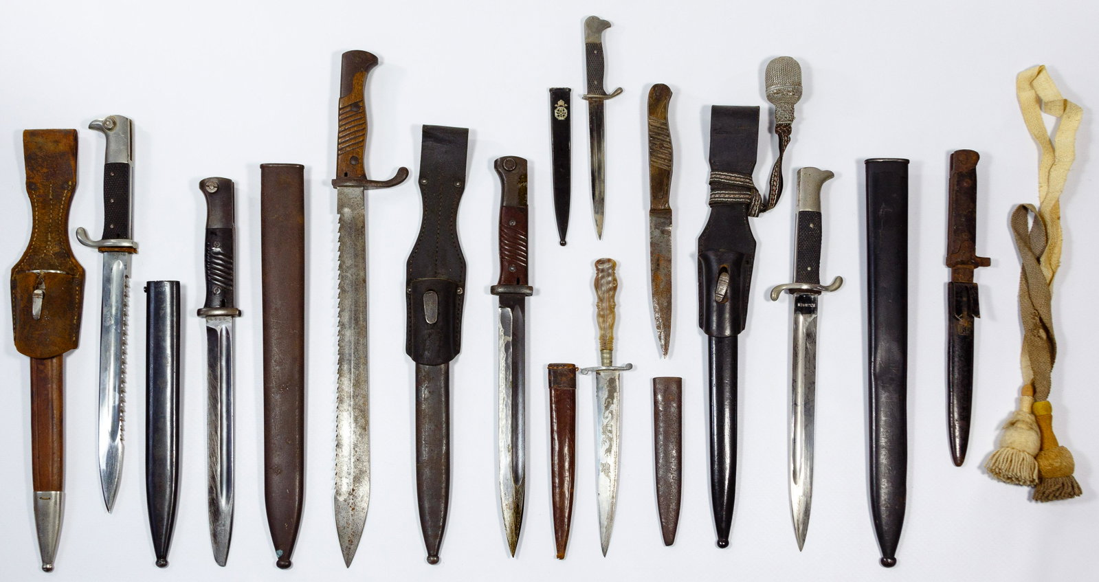 World War I and II Bayonet, Combat Knife and Dagger: World War I and II Bayonet, Combat Knife and Dagger Assortment (14) items including (5) bayonets with four having scabbards, one having leather holster and three having visible markings including serr