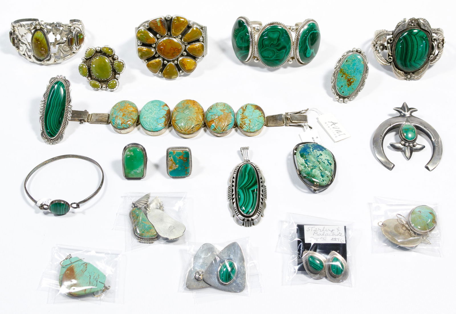 Sterling Silver Jewelry Assortment: Sterling Silver Jewelry Assortment (19) items including bracelets, earrings, rings, pendants and a brooch having green and yellowish-green turquoise / malachite stone decoration; most marked '925' or