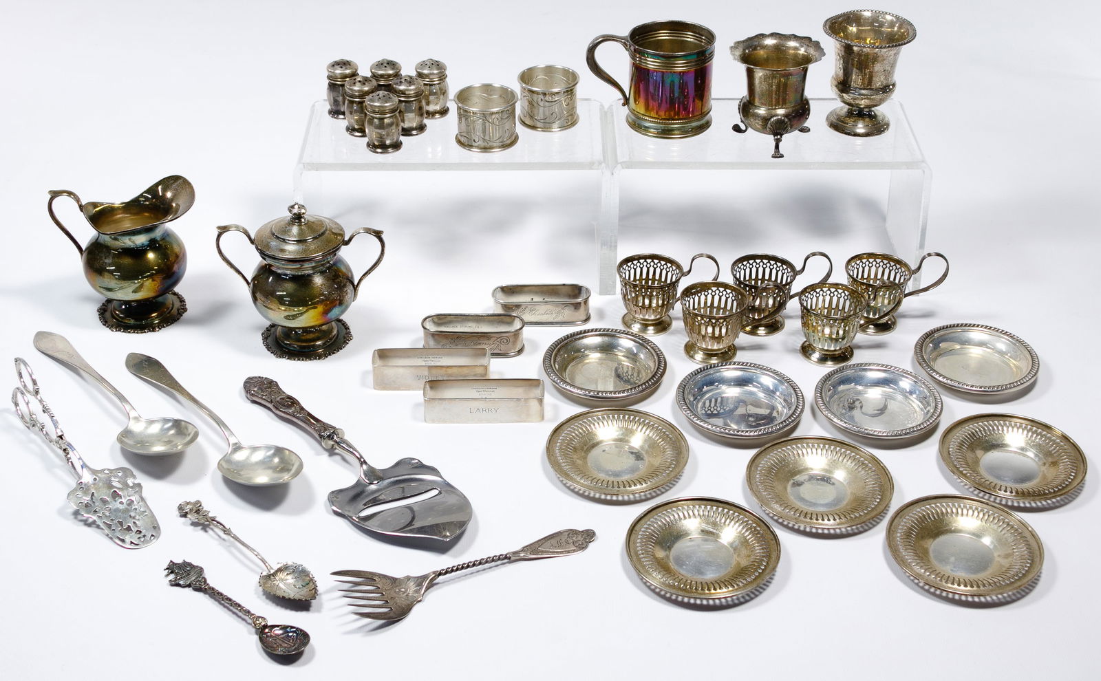 Sterling Silver and European Silver (830) Object: Sterling Silver and European Silver (830) Object Assortment (38) items including (6) napkin rings, (6) salt and pepper shakers, (2) toothpick holders, (9) coasters, (5) cup holders, handled cup by Wal