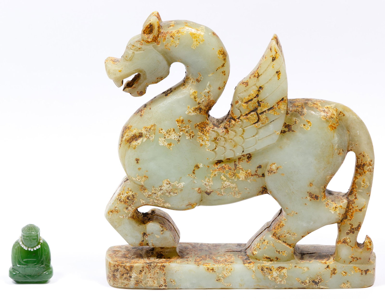 Chinese Jadeite Jade Assortment: Chinese Jadeite Jade Assortment (2) items including a miniature green jadeite jade representation of Buddha having (19) 0.0625 wide baroque pearls strung on a wire; and a Han Dynasty style winged hors