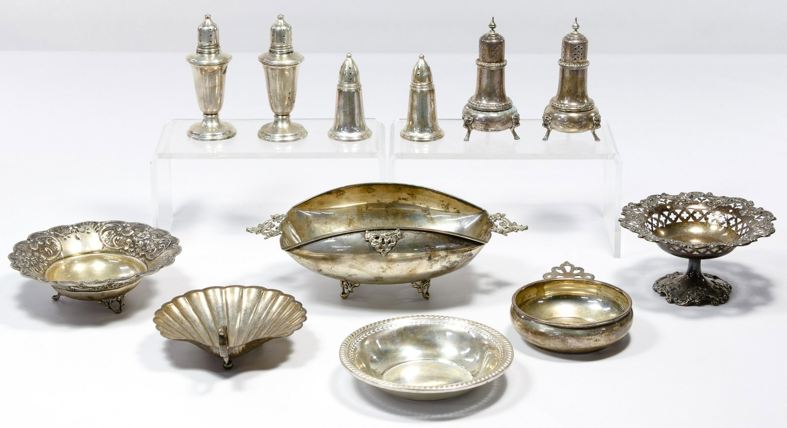 Sterling Silver Bowl and Shaker Assortment: Sterling Silver Bowl and Shaker Assortment (9) items including footed and handled serving bowl and a small round scalloped dish, footed shell shaped bowl #144, Gorham handled dish #699, small pierced 