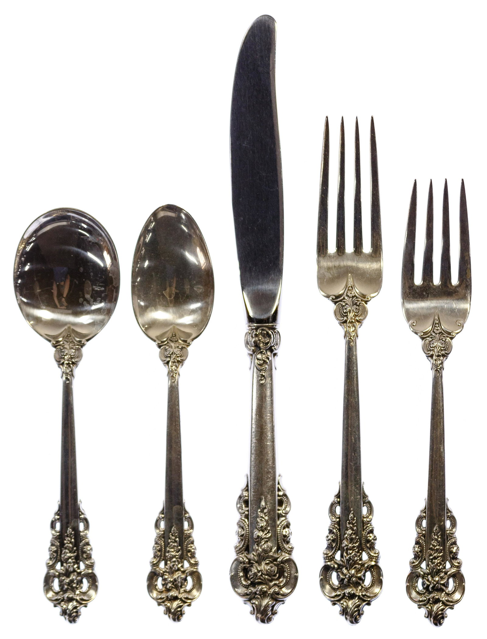 Wallace 'Grand Baroque' Sterling Silver Flatware: Wallace 'Grand Baroque' Sterling Silver Flatware (63) items including (12) knives having stainless steel blades, (12) dinner forks, (12) salad forks, (12) teaspoons, (12) soup spoons, a meat fork, a g