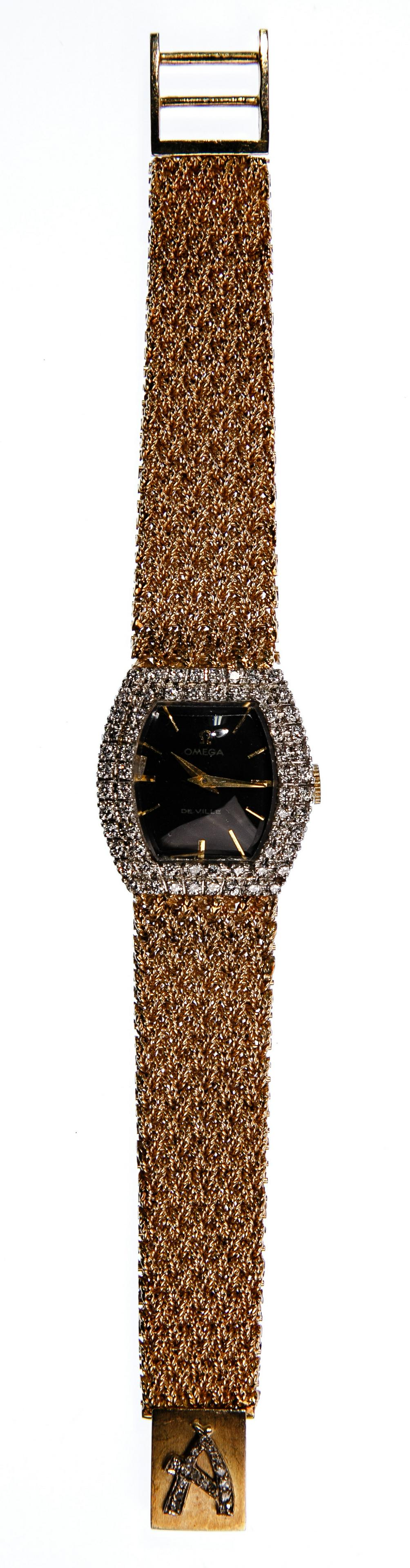 Omega 18k White Gold and Diamond Watch on 14k Yellow: Omega 18k White Gold and Diamond Watch on 14k Yellow Gold Band Having a 17-jewel movement, white gold case, black face, a bezel set with two rows of round cut diamonds and a yellow gold woven-rope ban