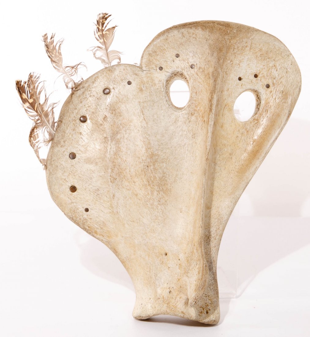 Karen Jenkins Olanna (American, 20th Century) Inuit Owl: Karen Jenkins Olanna (American, 20th Century) Inuit Owl Mask Carved fossilized whale bone and ptarmigan feather attachments, incised signature of Karen Olanna and artist label en verso Height: 13 inch