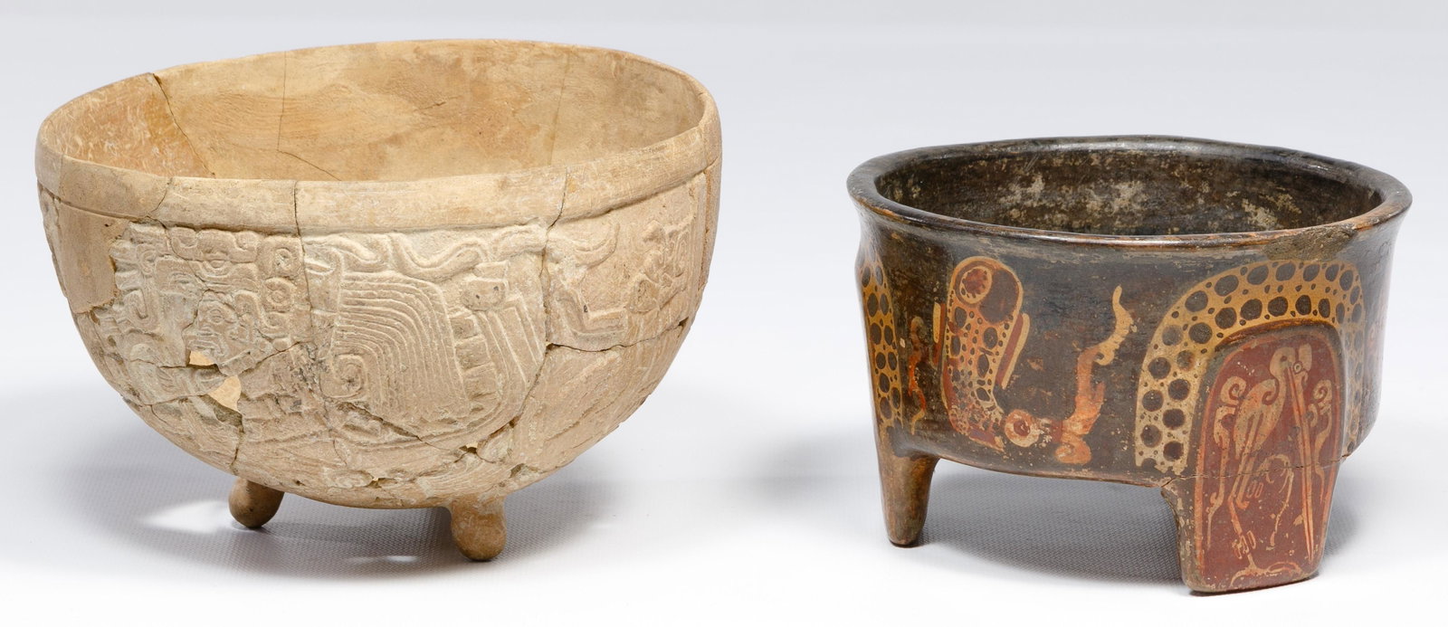 Mayan Pottery Assortment: Mayan Pottery Assortment (2) items including a 3-legged polychrome bowl having a bird motif on the outside; and a 3-legged bowl having a relief abstract motif Height: 4 1/2 inches, Diameter: 7 inches 
