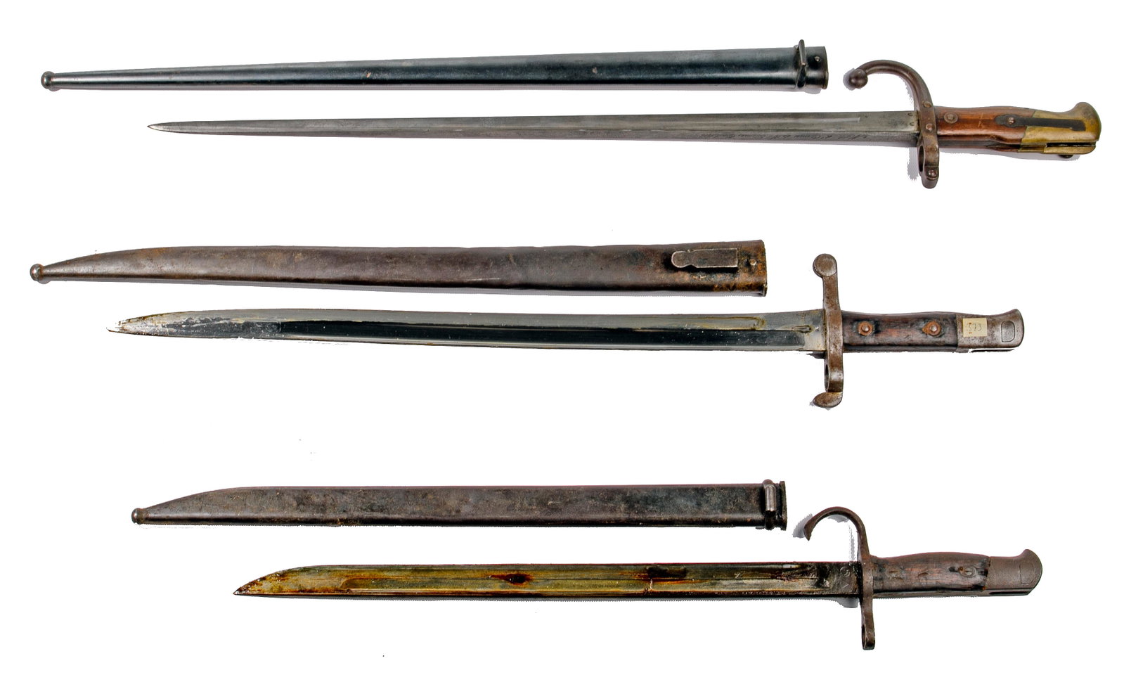 Bayonet and Scabbard Assortment: Bayonet and Scabbard Assortment (3) items including a St. Etienne 1876 bayonet and scabbard; 1886 bayonet and scabbard by Steyr; Japanese World War II bayonet and scabbard Property from: an Itasca, Il