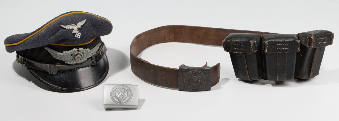 World War II German Military Assortment: World War II German Military Assortment (3) items including an aviator / paratrooper Waffenfarbe wool visor cap; leather belt having a 3-compartment ammunition holder stamped 'Munich, Germany 1946' on