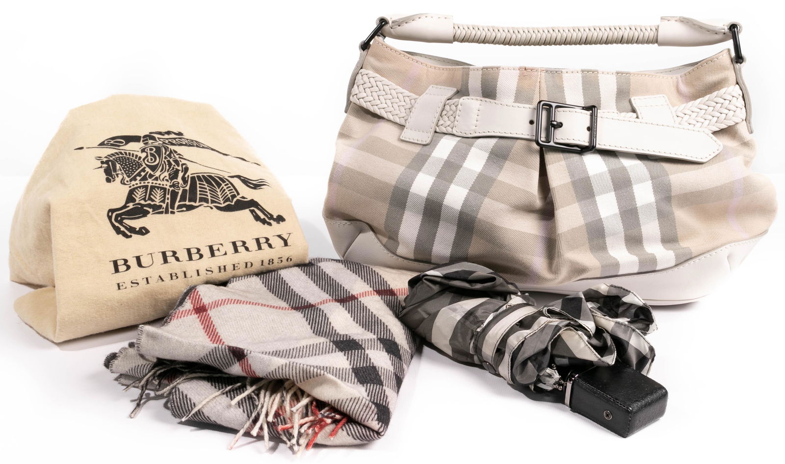 Burberry Assortment: Burberry Assortment (3) items including a Nova shoulder handbag and dust cover; an icon reversible cashmere scarf having plastic tag; and a collapsible purse umbrella Height: 17 inches, Width: 11 inch