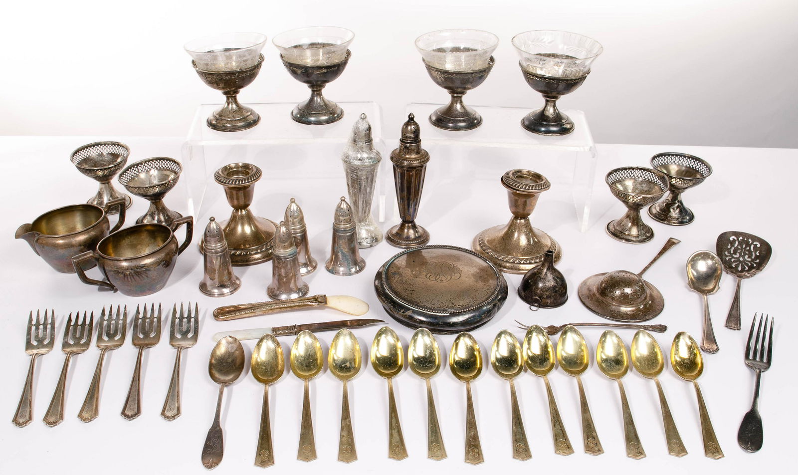 Sterling Silver Assortment: Sterling Silver Assortment (45) items all marked 'sterling' including (8) sherbet cup holders with (4) having glass inserts; a cream and open sugar; a tea strainer; a funnel; (12) teaspoons; (5) pastr