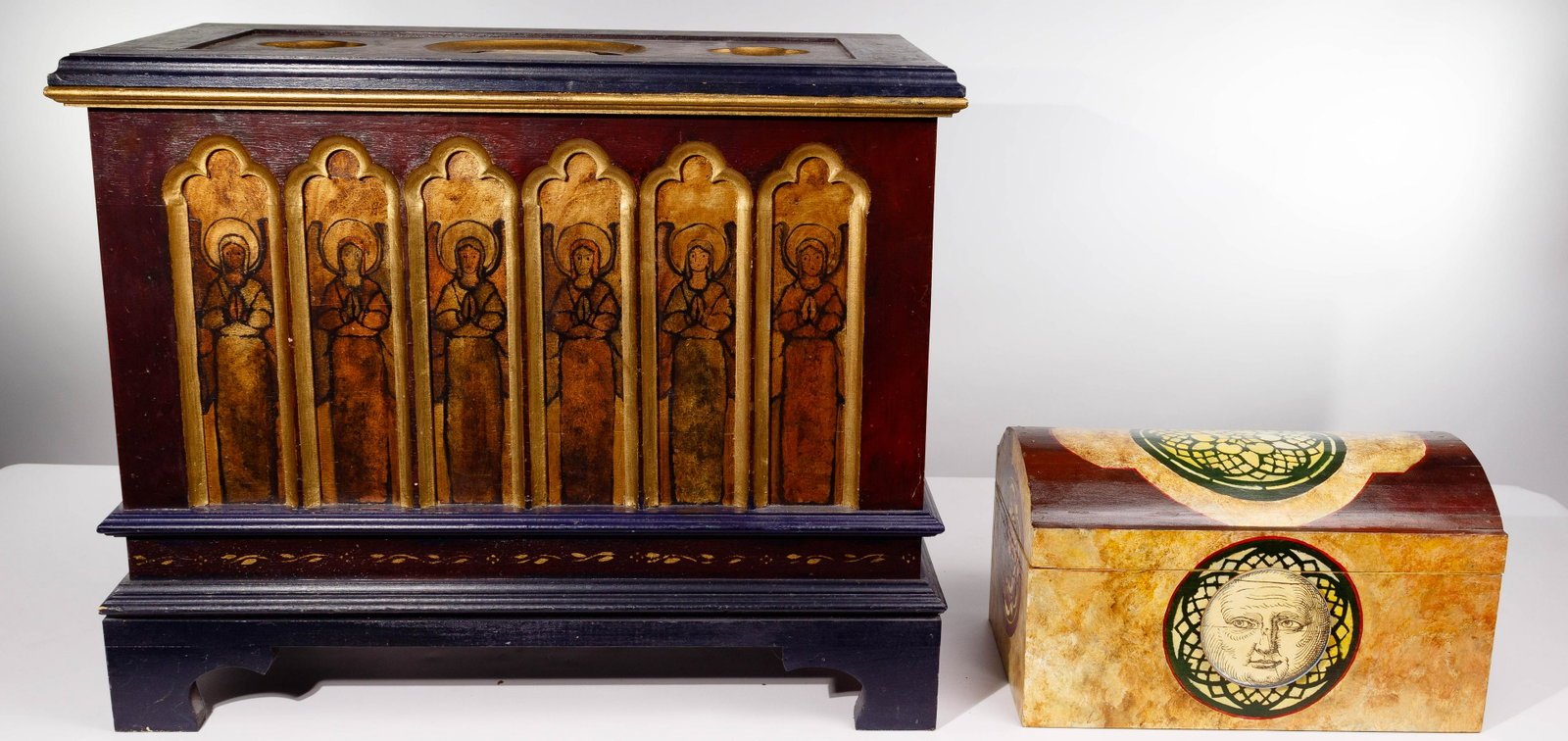 Gothic Revival Style Painted Chests: Gothic Revival Style Painted Chests (2) hinged lid chests including a floor chest having a sun and praying angel decoration; and humpback chest having a moon and rose window design; both having black 