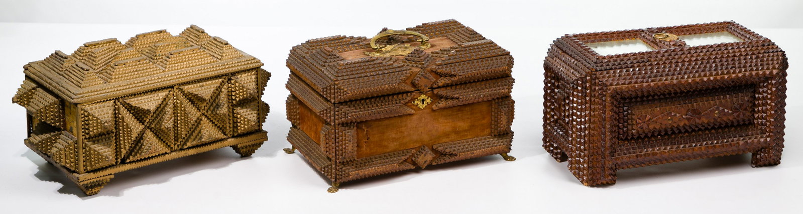 Tramp Art Box Assortment: Tramp Art Box Assortment (3) items, assembled using notched-edge boards stacked pyramid style, including a gold painted top hinge box; a mirrored top box having a brass pull; and hinged top and a fabr