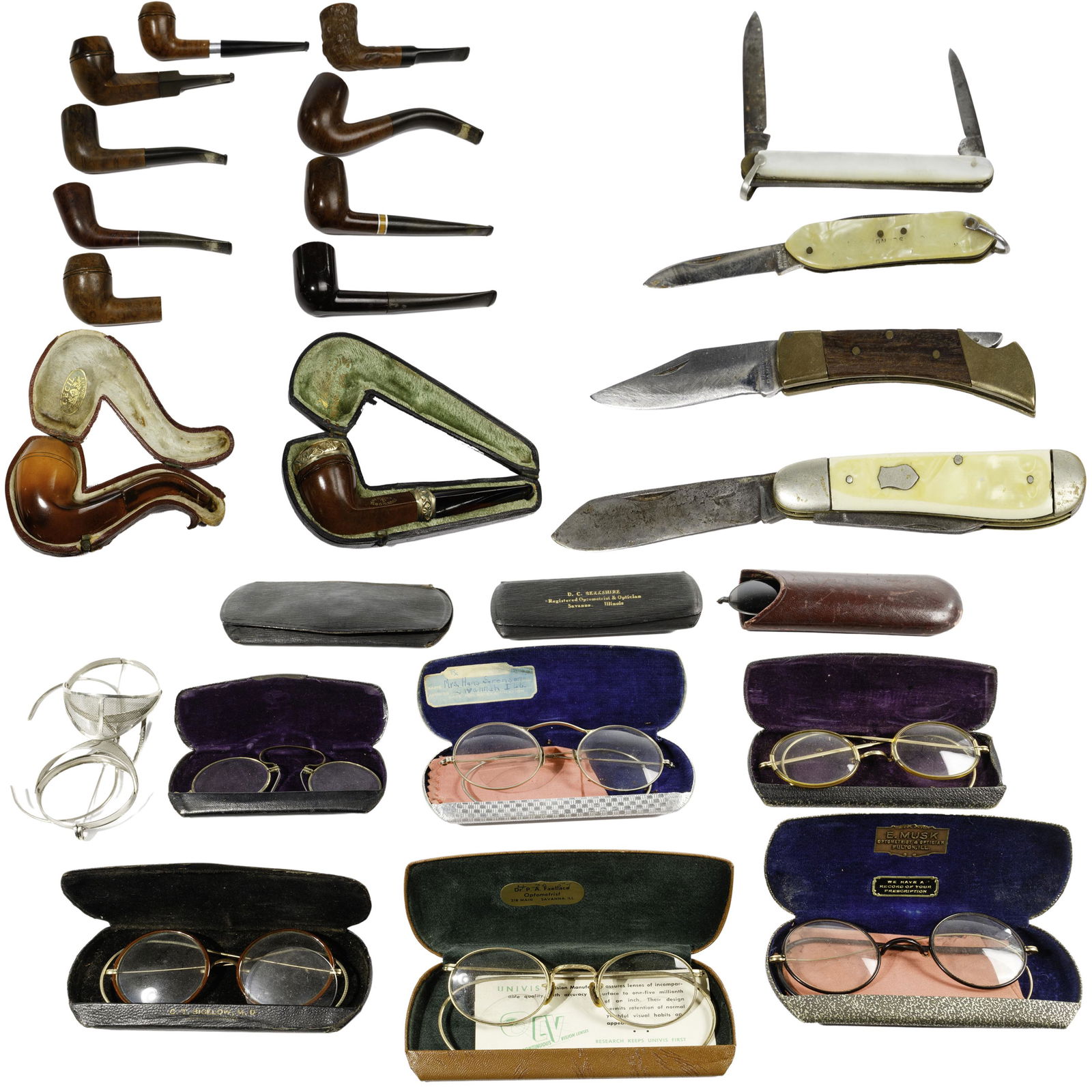 Men's Desk Assortment: Men's Desk Assortment (26) items including (11) pipes, featuring 'Cecil' Meerschaum having amber color stem in a leather case; genuine 'Redmanol' metal rimmed straight, red color stem, black leather c