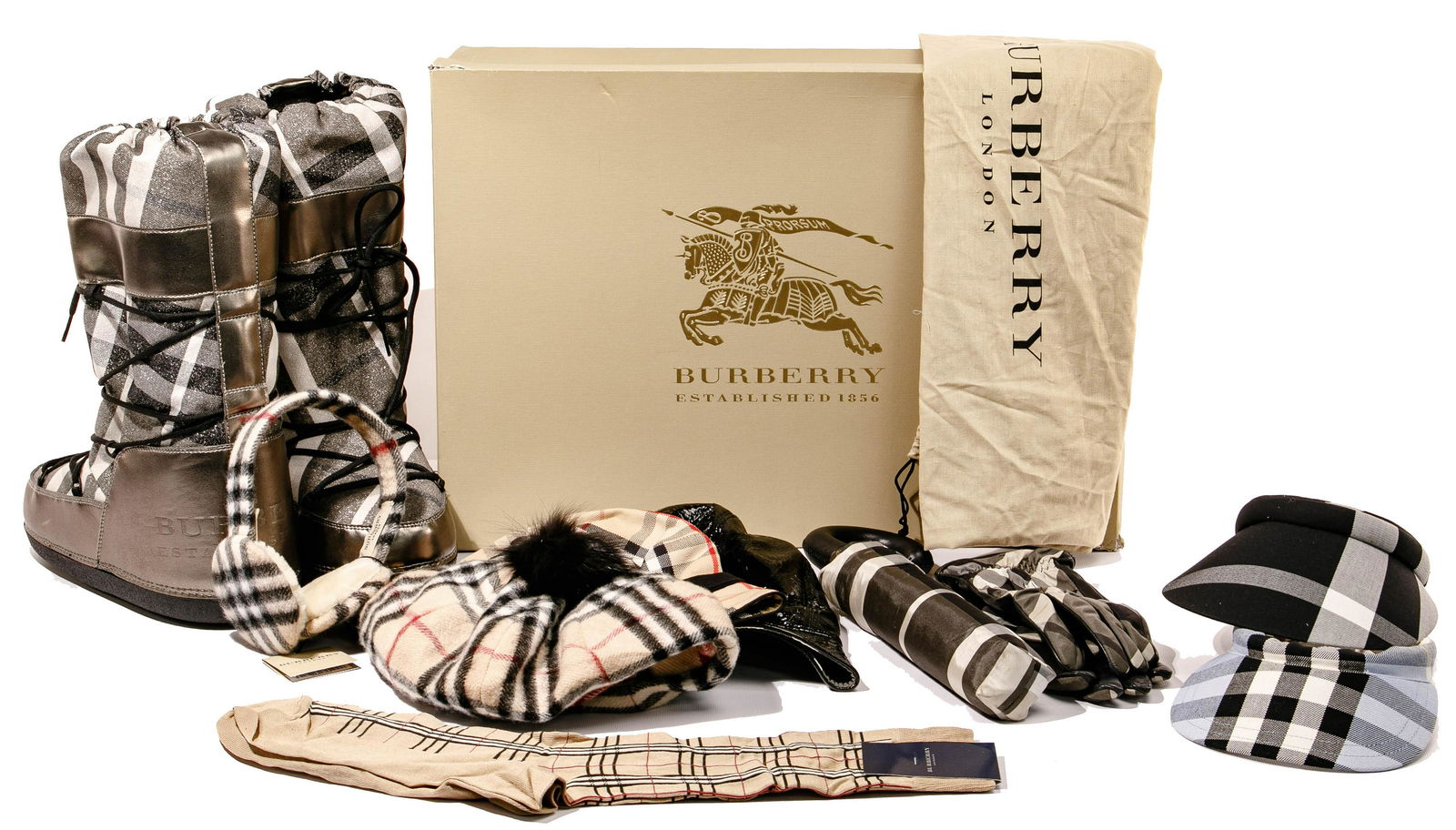 Burberry Assortment: Burberry Assortment (11) items including a pair of Moon snow ski boots in size 41-43 having original fabric over cardboard box; a reversible black leather bucket hat having plaid lining, size 'L'; a c