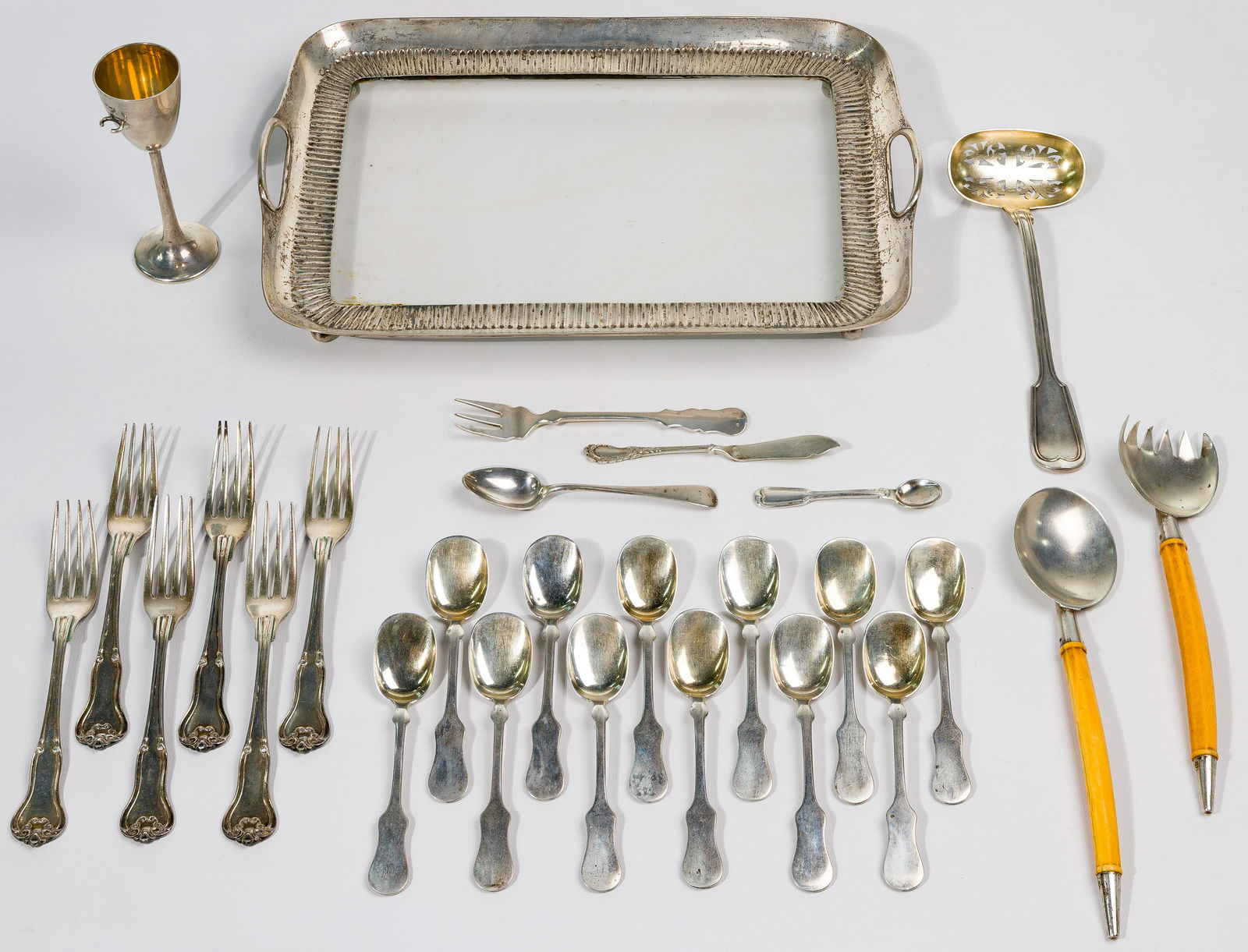 Austrian Silver Flatware and Hollowware Assortment: Austrian Silver Flatware and Hollowware Assortment (31) items including an '750' marked silver lined glass tray; (2) '812' silver marked serving utensils with bone handles also marked 'VC' on the silv
