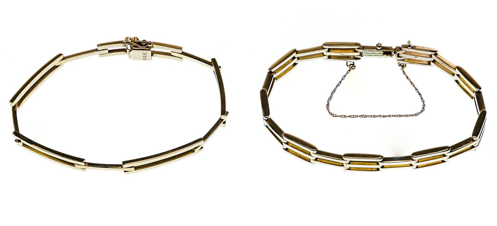 14k Yellow Gold Link Bracelets: 14k Yellow Gold Link Bracelets (2) link varieties with one having a safety chain, the other having a safety clasp; both stamped '14k' on the clasp Length: 7 inches (both) Weight: 18.31 dwts. (total we