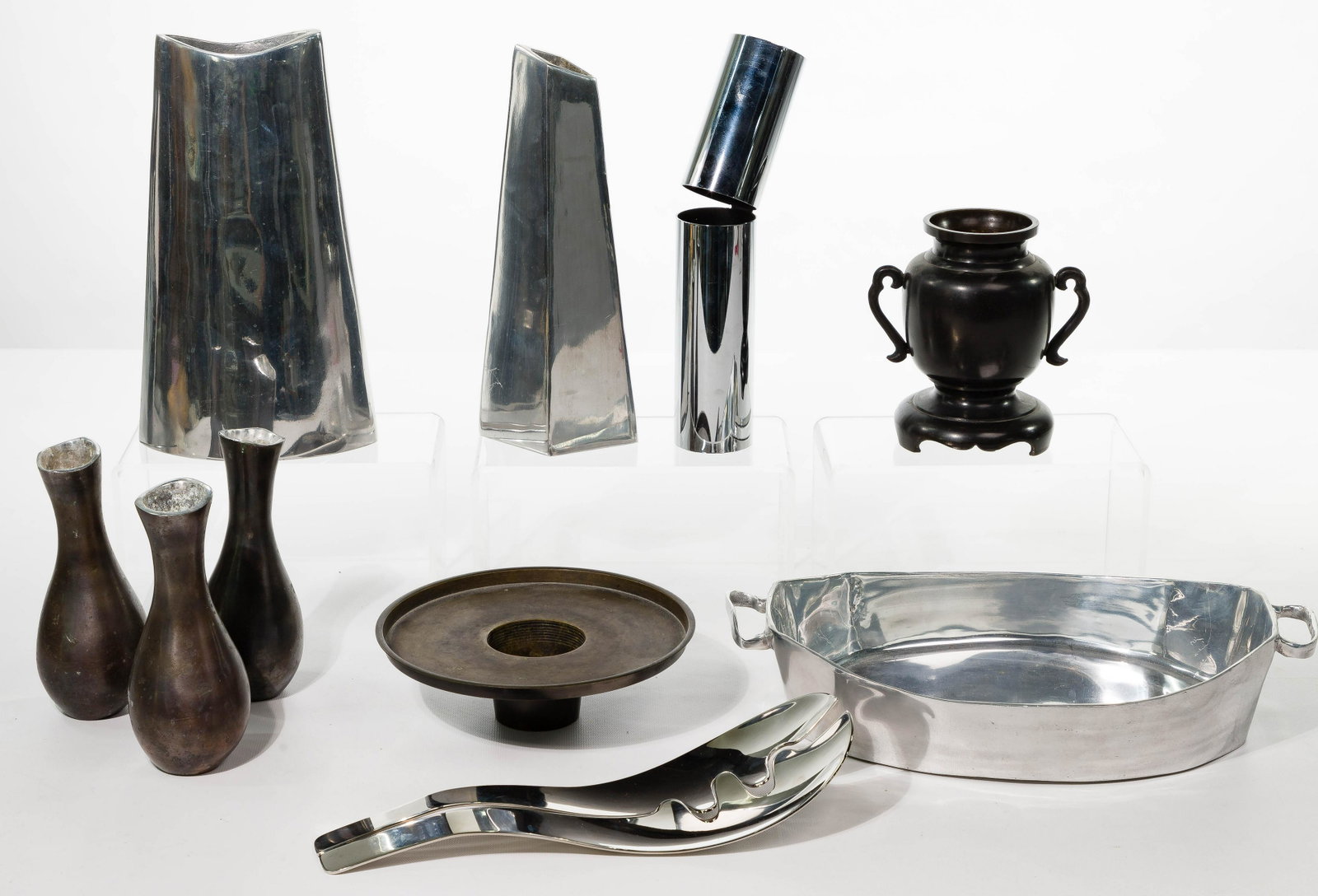 Modernist Metal Object Assortment: Modernist Metal Object Assortment (10) items including Holland Daniel L. Boone polished pewter handled serving dish and (2) vases; Designfenzider chrome tube sculpture; Umbra polished stainless steel 