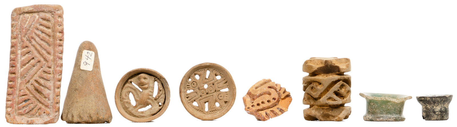 Pre-Columbian Ear Spool and Seal Assortment: Pre-Columbian Ear Spool and Seal Assortment (8) items including a green stone spool; (3) pottery spools having reticulated zoo-morphic decoration; a clay roller seal; and (3) stamp seals having geomet