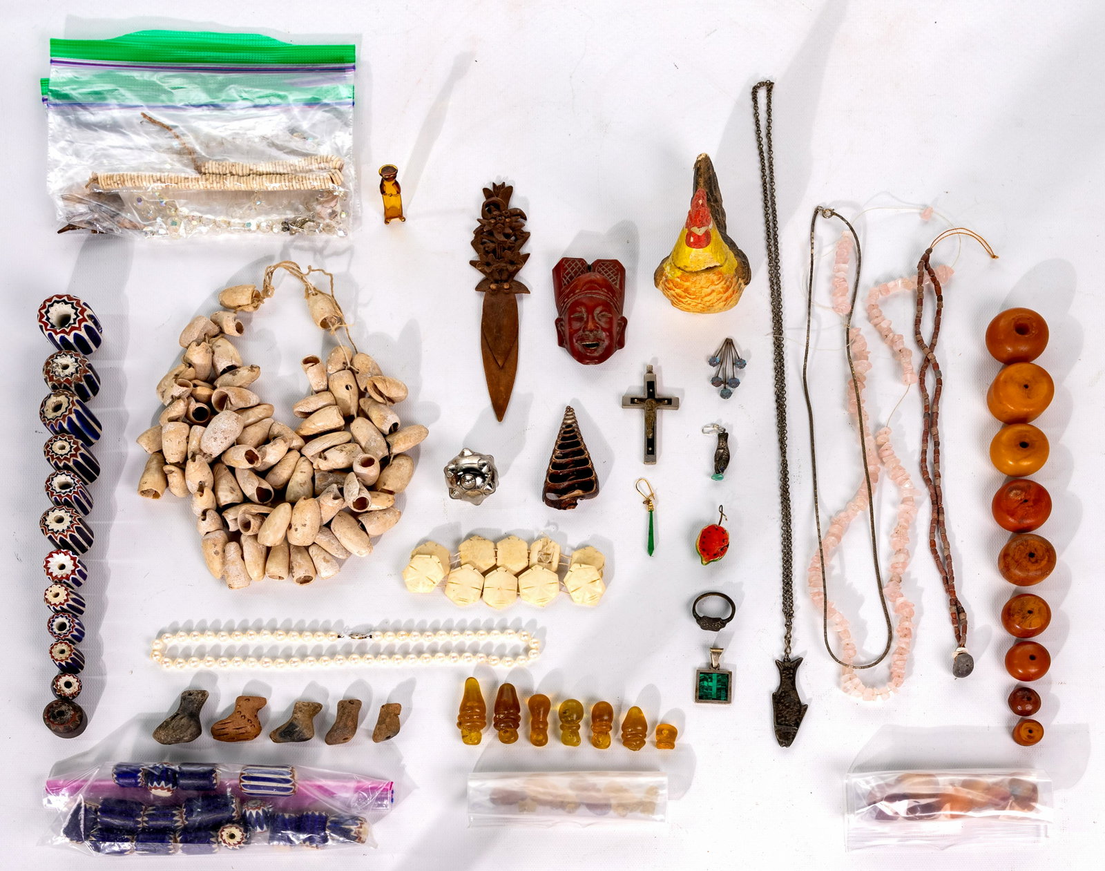 Ethnic Jewelry and Accessory Assortment: Ethnic Jewelry and Accessory Assortment Over (50) items including a Balinese carved coconut shell head piece having pierced depictions of Hindu deities; an Indonesian wood face pendant having inlaid b