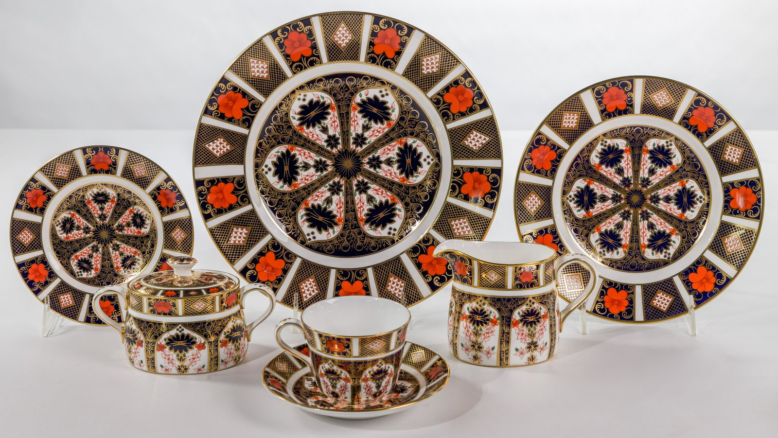 Royal Crown Derby 'Imari' Bone China Service: Royal Crown Derby 'Imari' Bone China Service (67) items including (12) dinner plates, (12) salad plates, (12) bread and butter plates, (14) cups and (14) saucers, creamer, lidded sugar and porcelain h