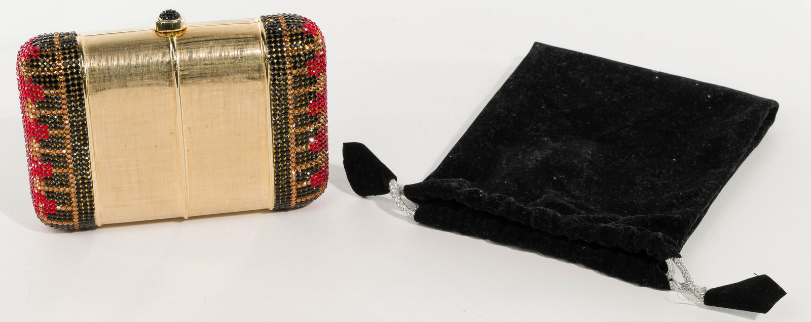 Judith Leiber and Swarovski Crystal for Bonwit Teller: Judith Leiber and Swarovski Crystal for Bonwit Teller Minaudere Rounded oblong bag transforms into shoulder bag with 20-inch gold chain, having a brushed gold-tone metal center flanked by crystals in