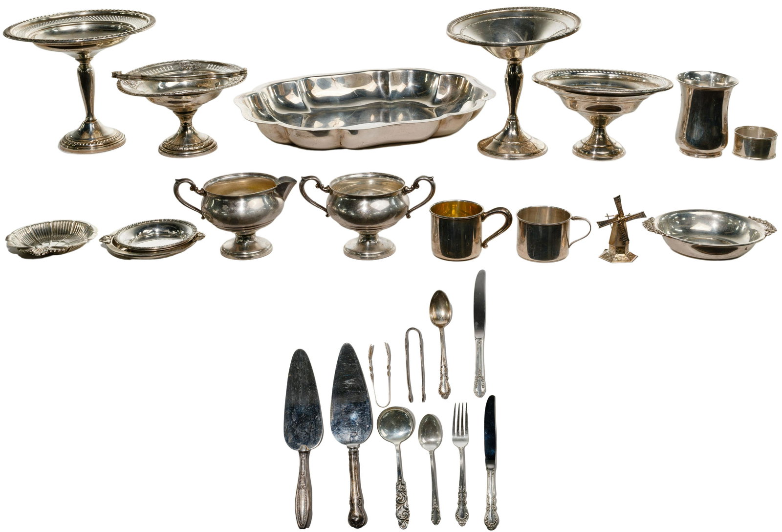 Sterling Silver Hollowware and Flatware Assortment: Sterling Silver Hollowware and Flatware Assortment (26) items including a tray by Durham, napkin ring, (3) cups, windmill, (2) sugar tongs, (2) sterling handled cake knives, fork by Rogers, (2) sterli