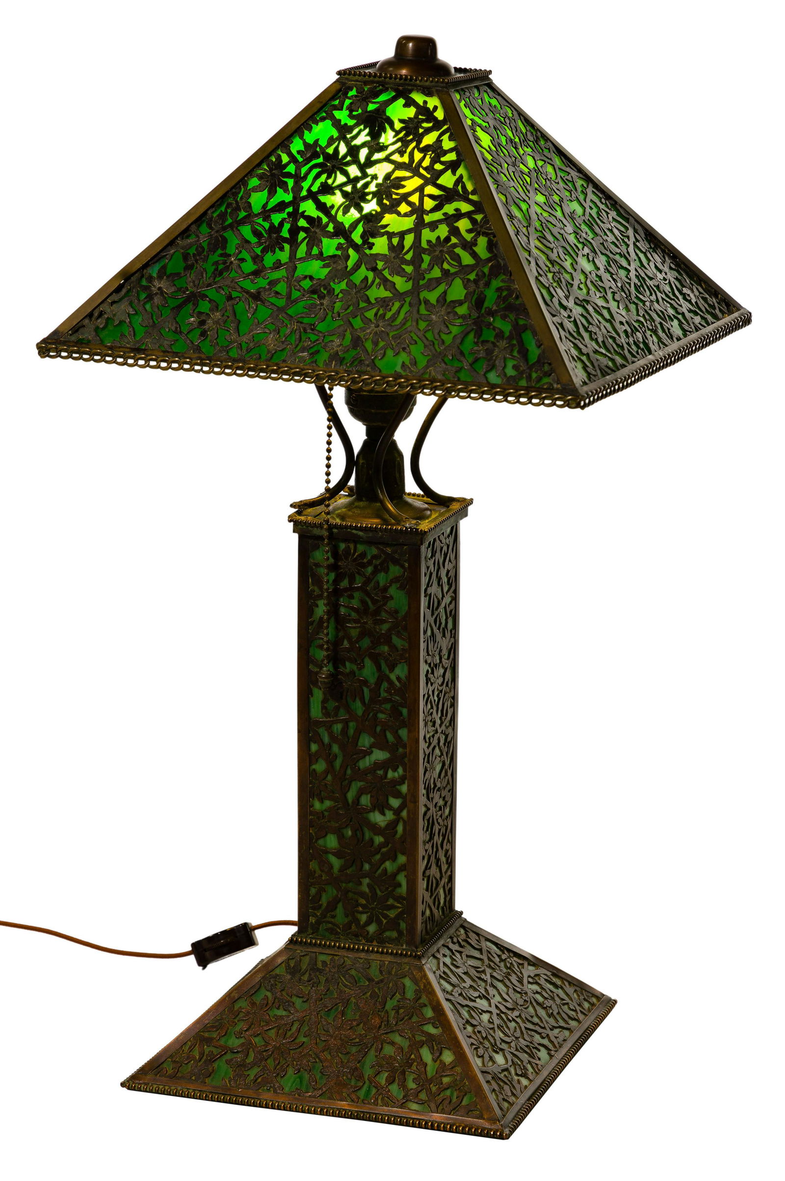 Apollo Studios Slag Glass Panel with Metal Overlay: Apollo Studios Slag Glass Panel with Metal Overlay Table Lamp Having a (4) panel shade, bronze overlay with openwork design of flowers, stems, leaves and butterflies against a green slag background; m