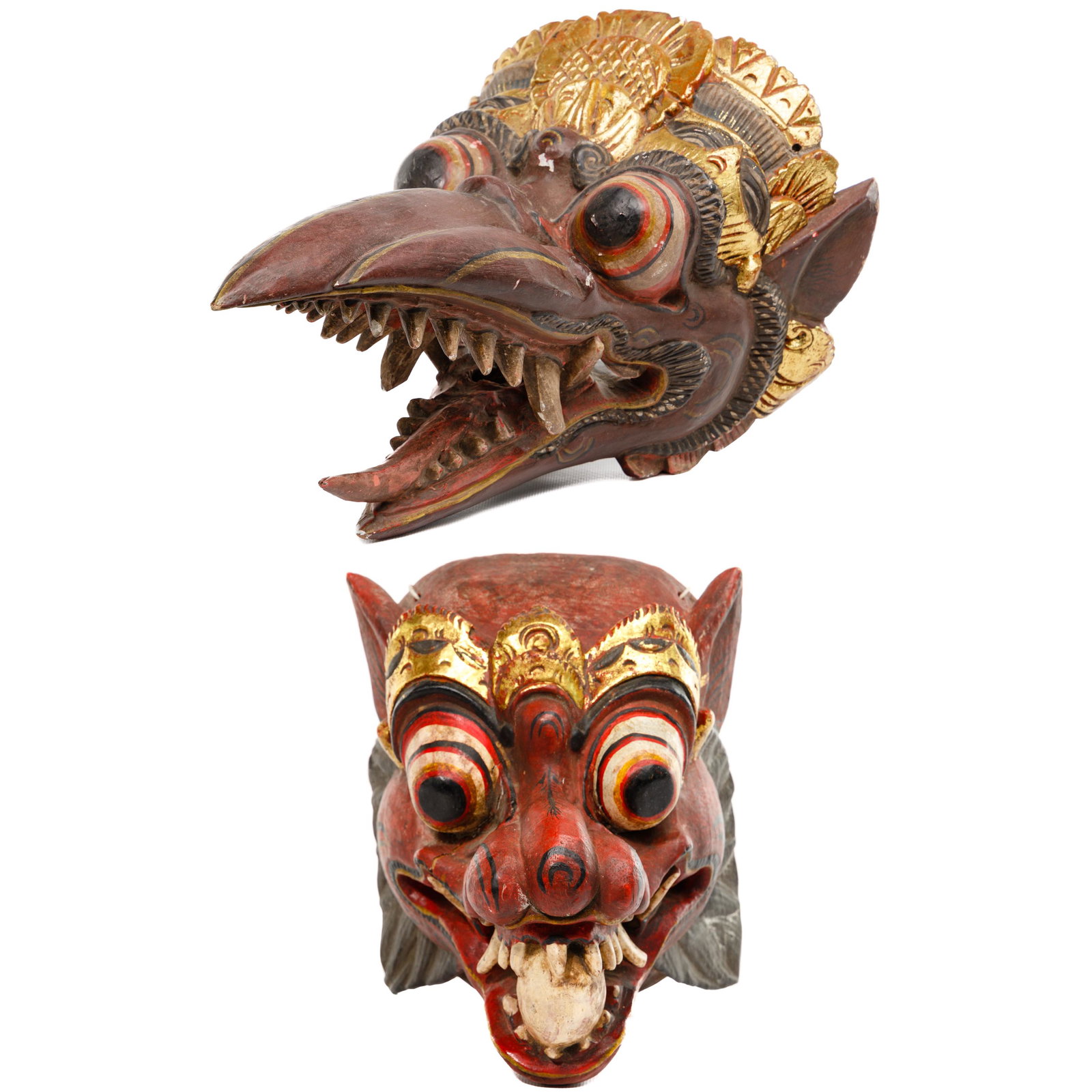 Balinese Carved Wood Masks: Balinese Carved Wood Masks (2) 20th century polychrome painted examples from Indonesia Height: 9 inches, Length: 16 inches, Width: 9 inches (larger mask) Condition: Very Good, minor chips to paint; ov