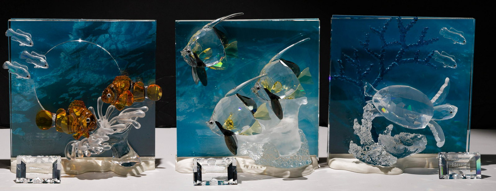 Swarovski Crystal 'Wonders of the Sea' Trilogy: Swarovski Crystal 'Wonders of the Sea' Trilogy (3) items including 2005 #657120 'Harmony'; 2006 #684266 'Eternity'; 2007 #854650 'Community'; series retired 2007; each having stand and background; eac