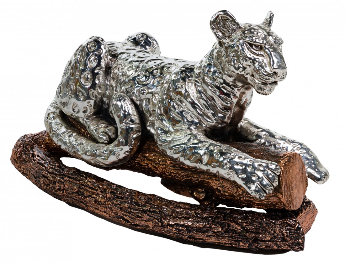 Plata Artistica (999) Sterling Coated Leopard Sculpture: Plata Artistica (999) Sterling Coated Leopard Sculpture 20th century, reclining leopard on copper-toned branch in two pieces, marked 'Mexico plata 999' near base of tail Height: 11 inches, Length: 18 